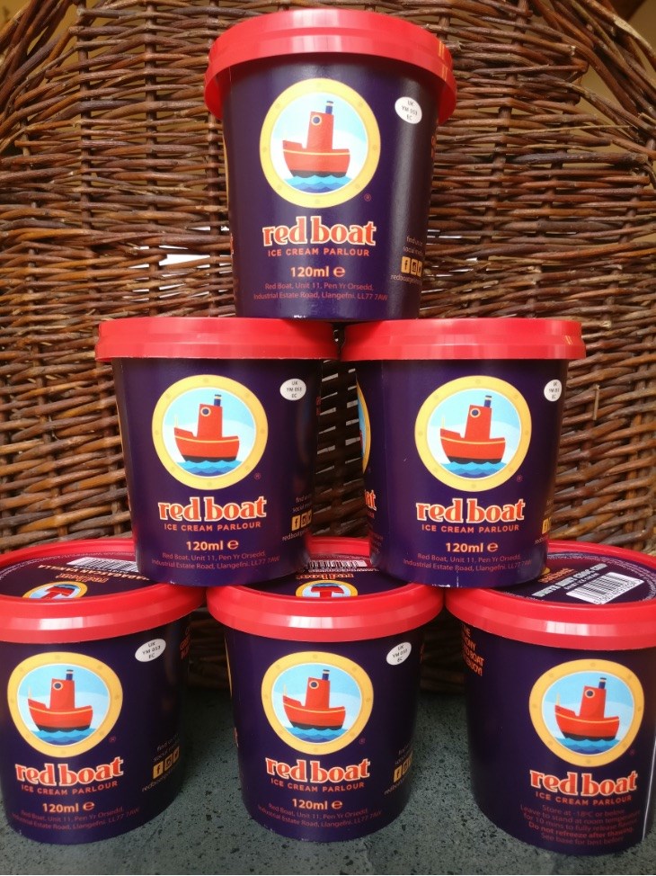 Stack of red boat ice cream tubs